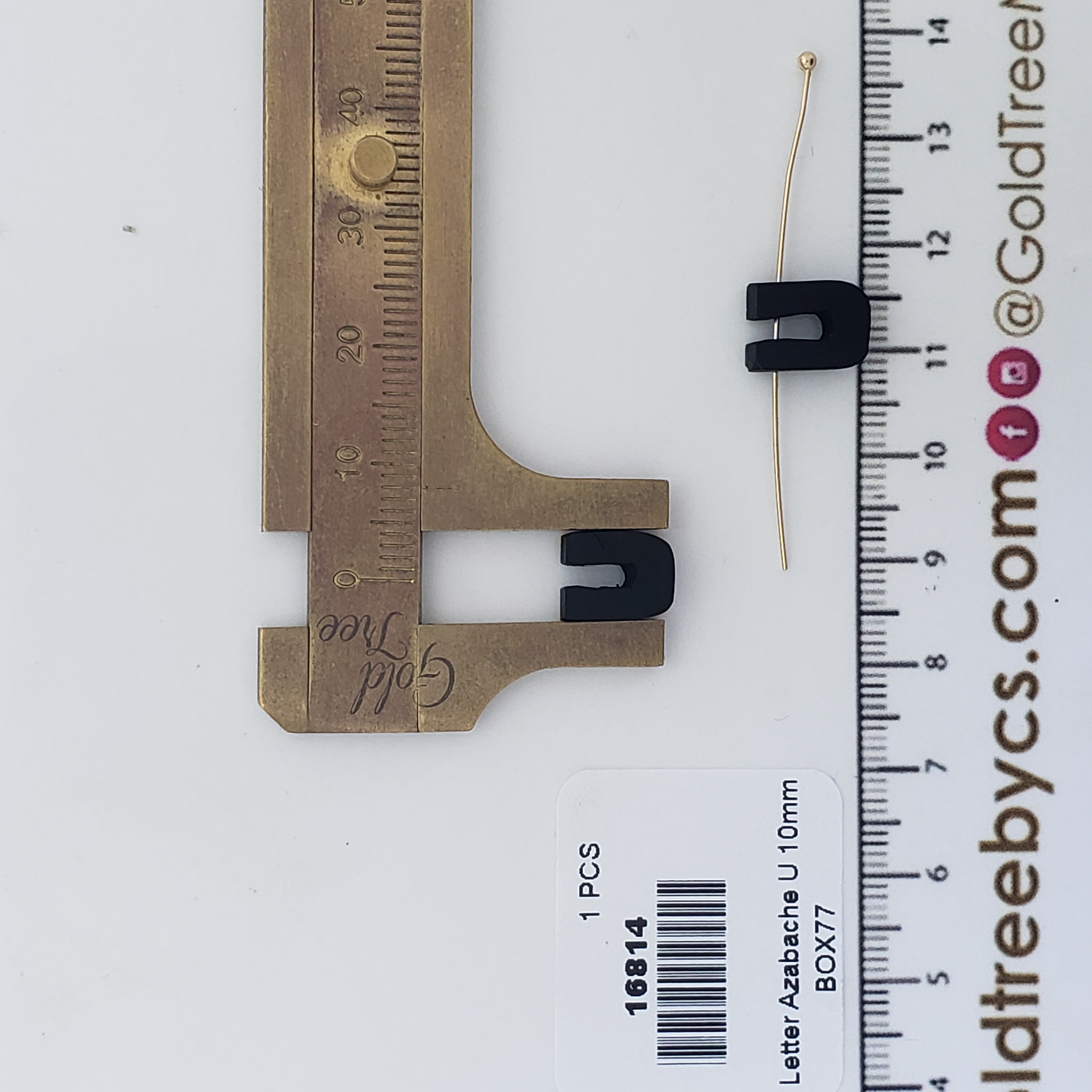 16814 Espaciador de azabache con inicial U