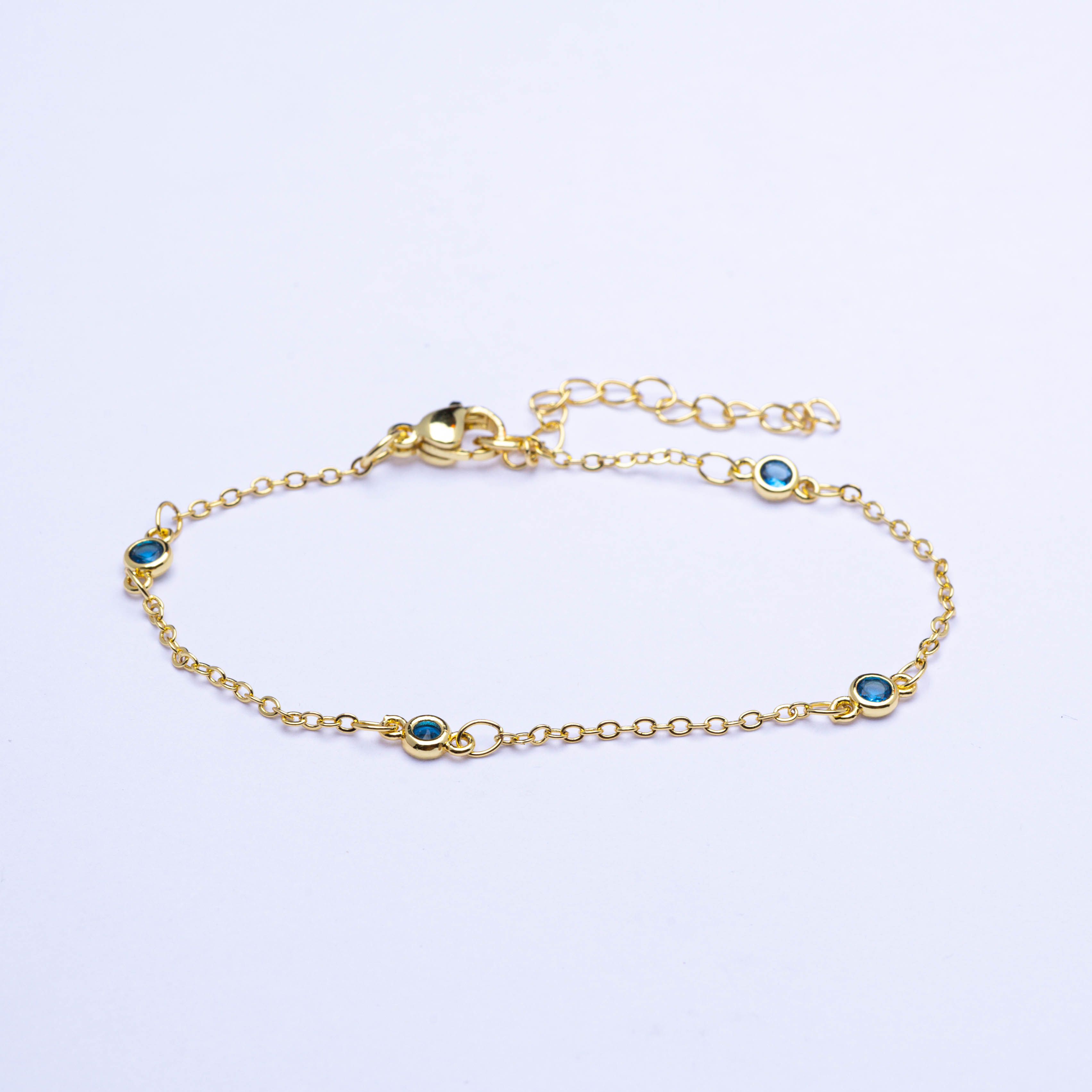 20437 Gold Bracelets with Light Blue Crystals
