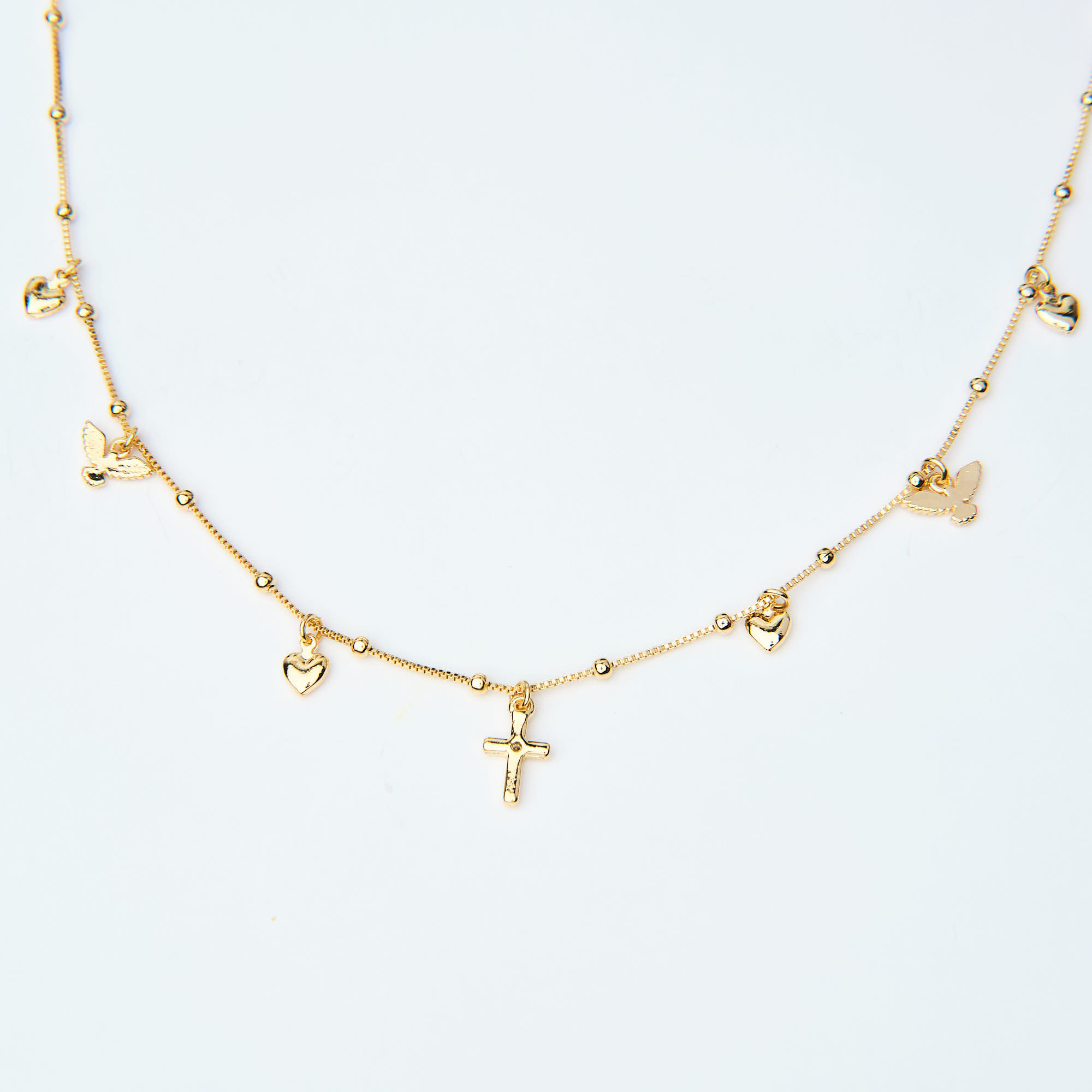 16896  Gold Necklace with Heart, Cross, and Dove Charms