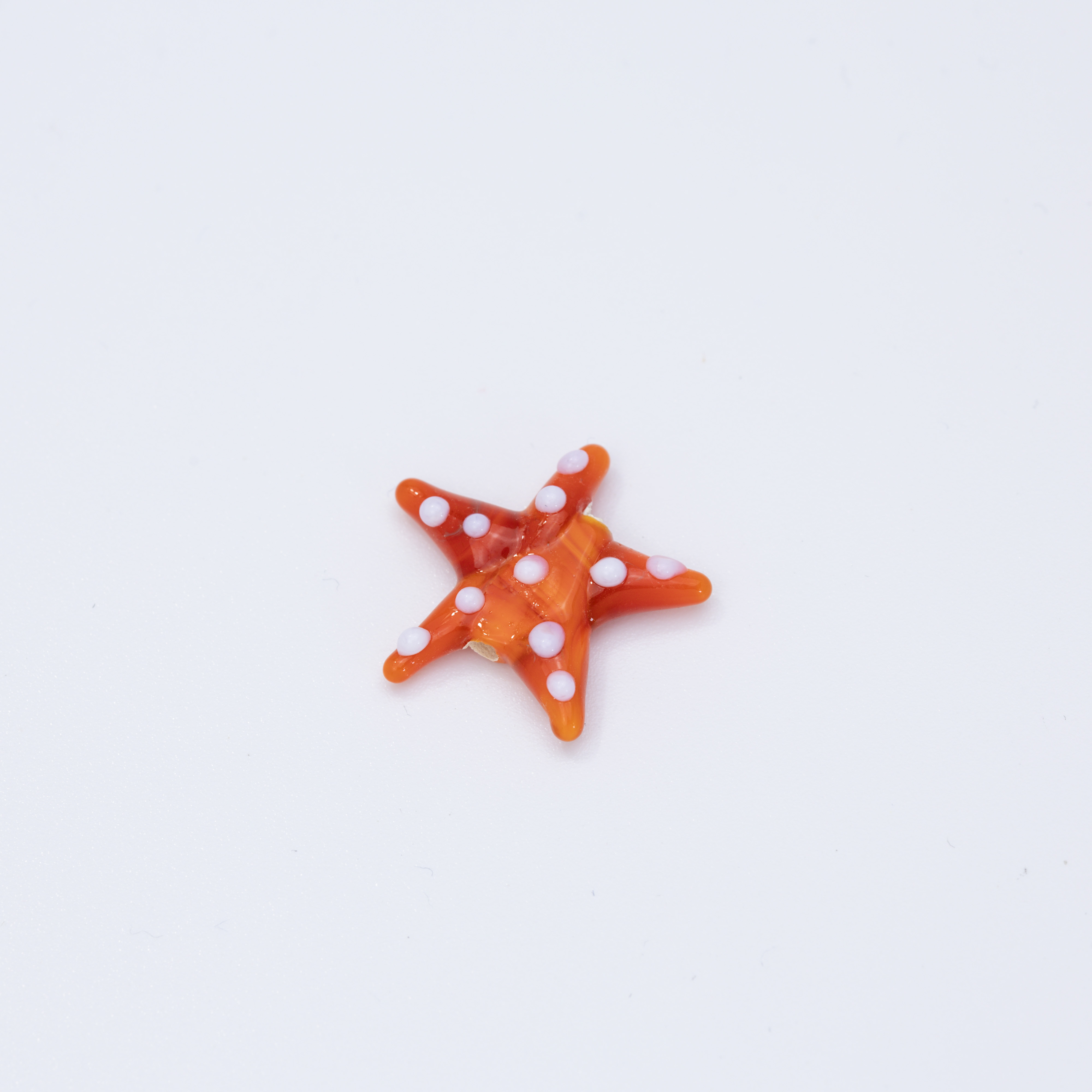 19622 Orange And White Starfish Murano Spacer