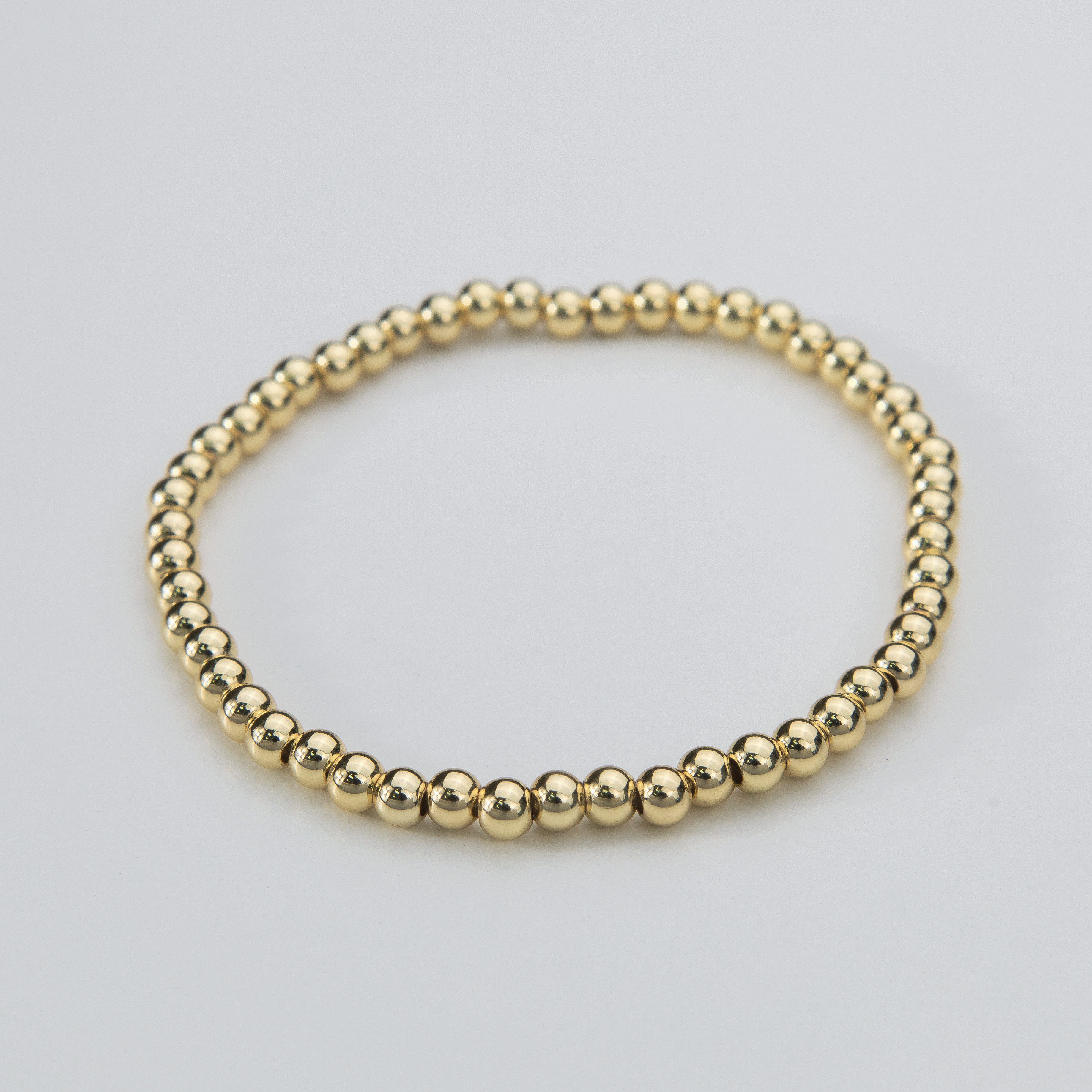 18673 4mm Gold Bead Elastic Bracelet