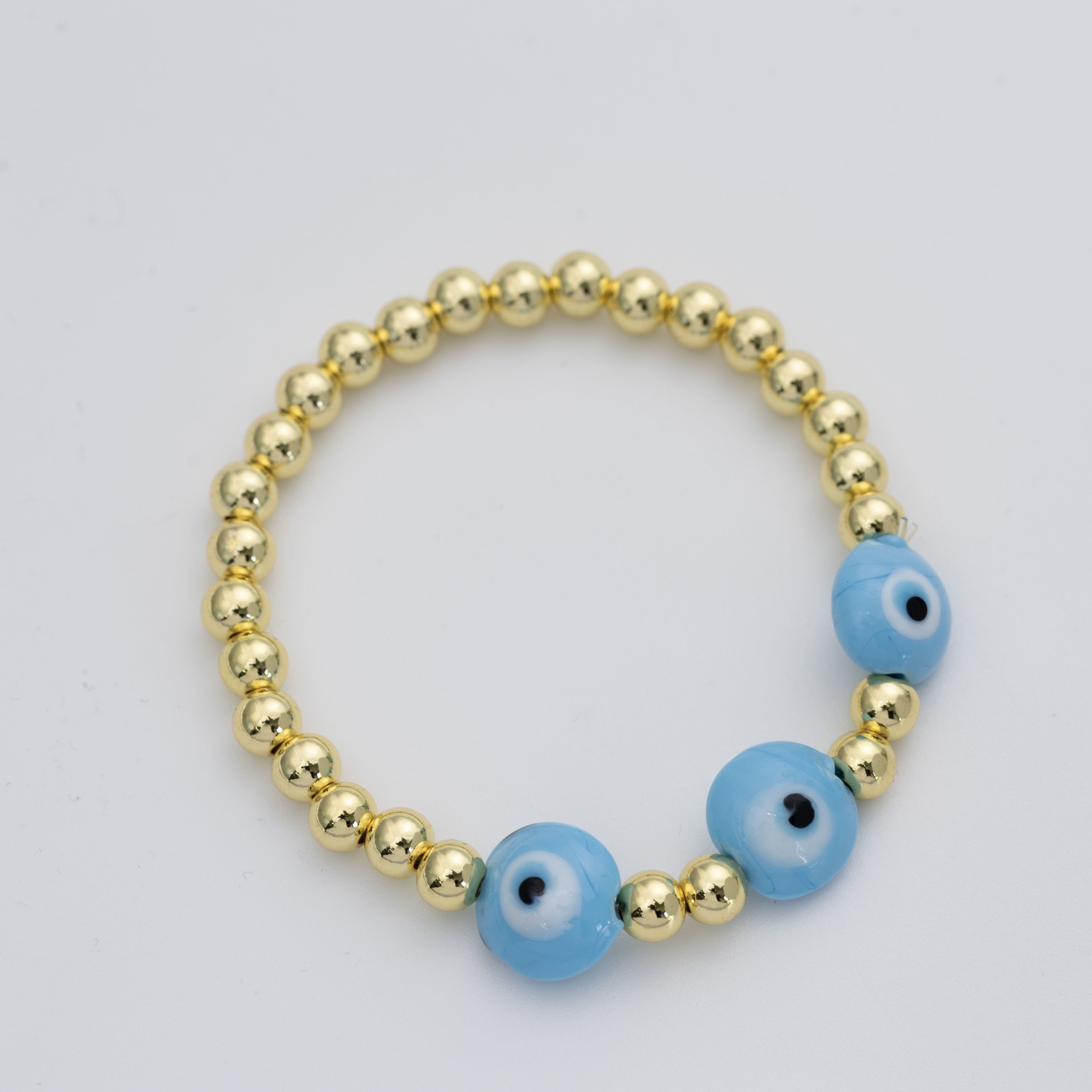19485 Gold Beaded 5mm Bracelet with Lblue Evil Eye