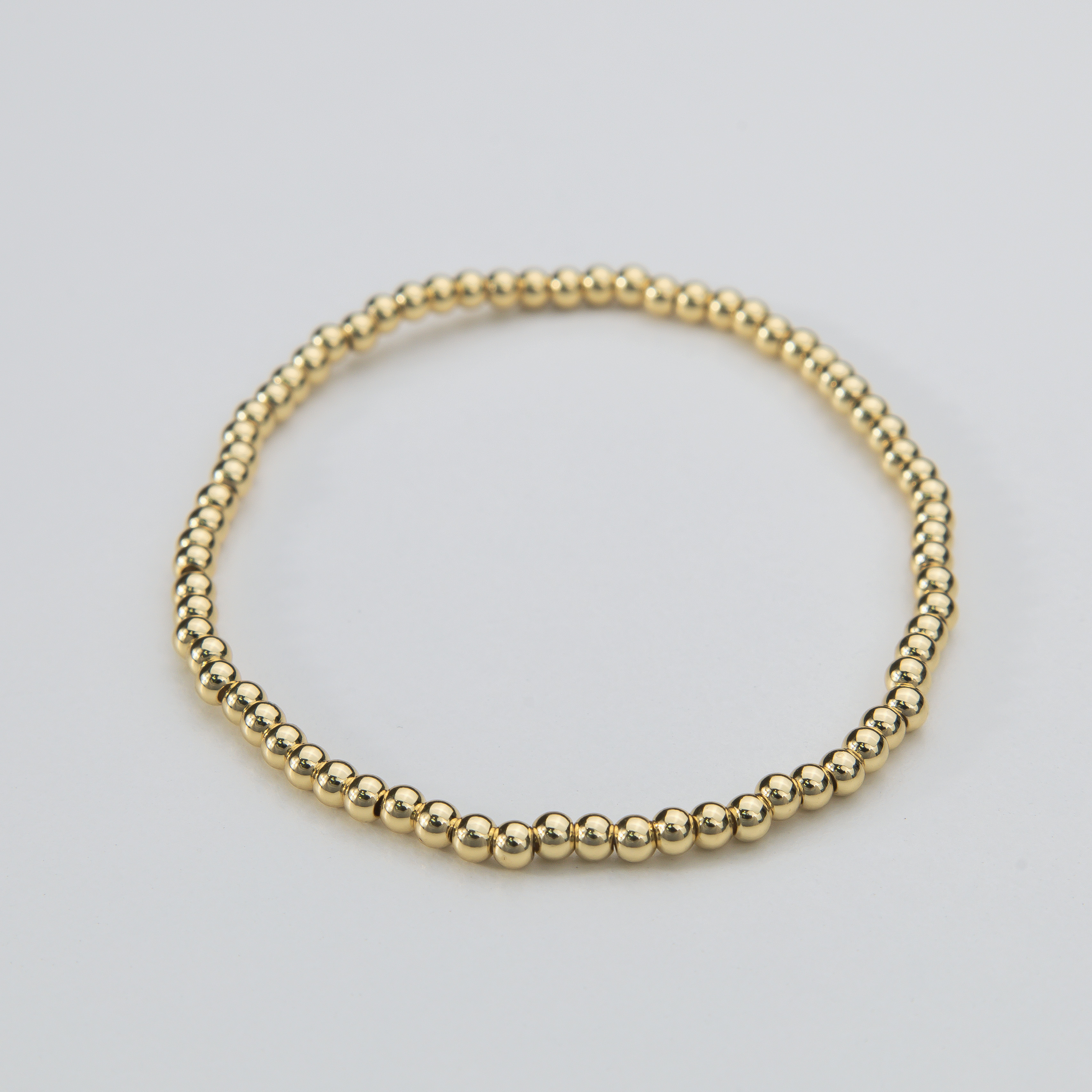 18674 3mm Gold Bead Elastic Bracelet