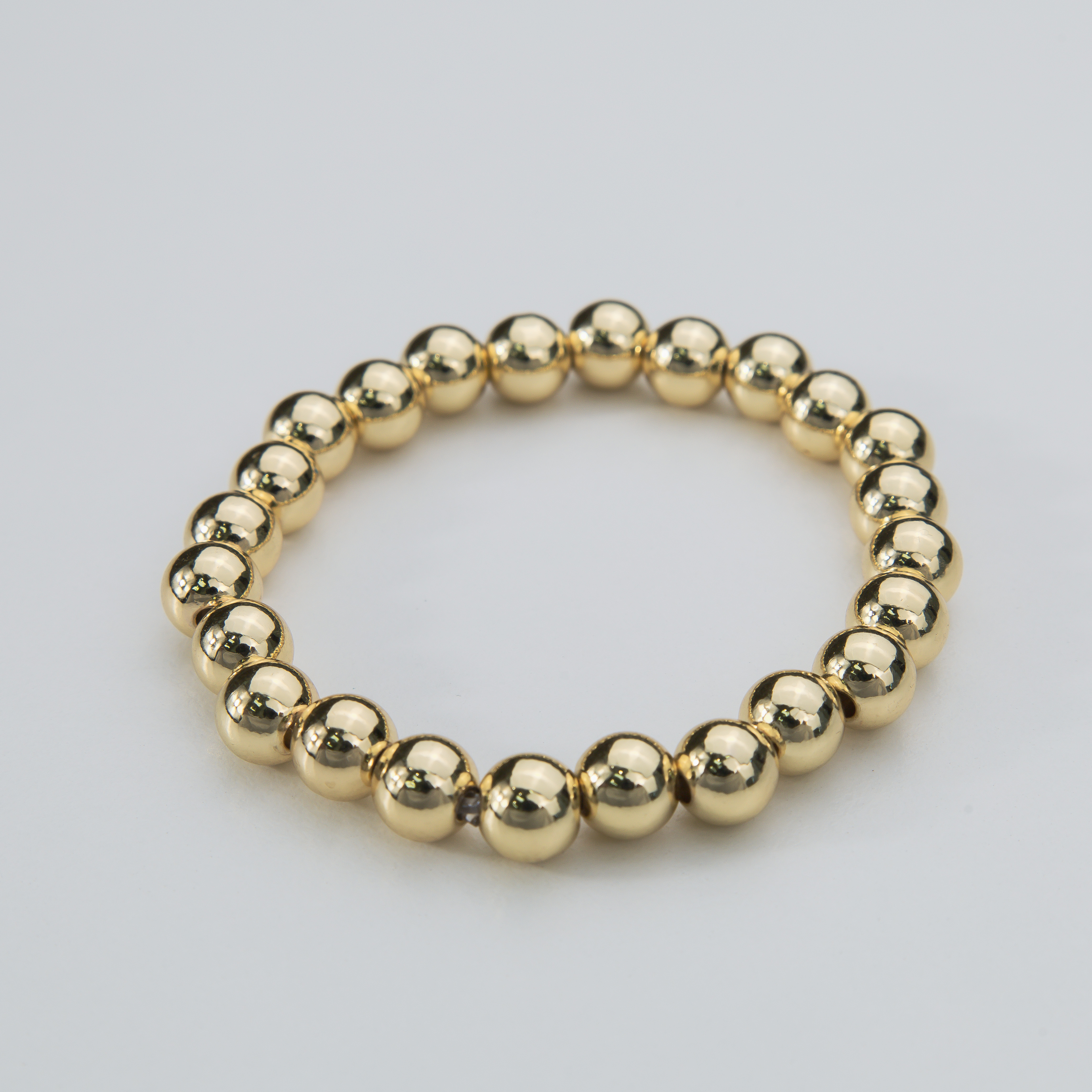 18676 8mm Gold Bead Elastic Bracelet