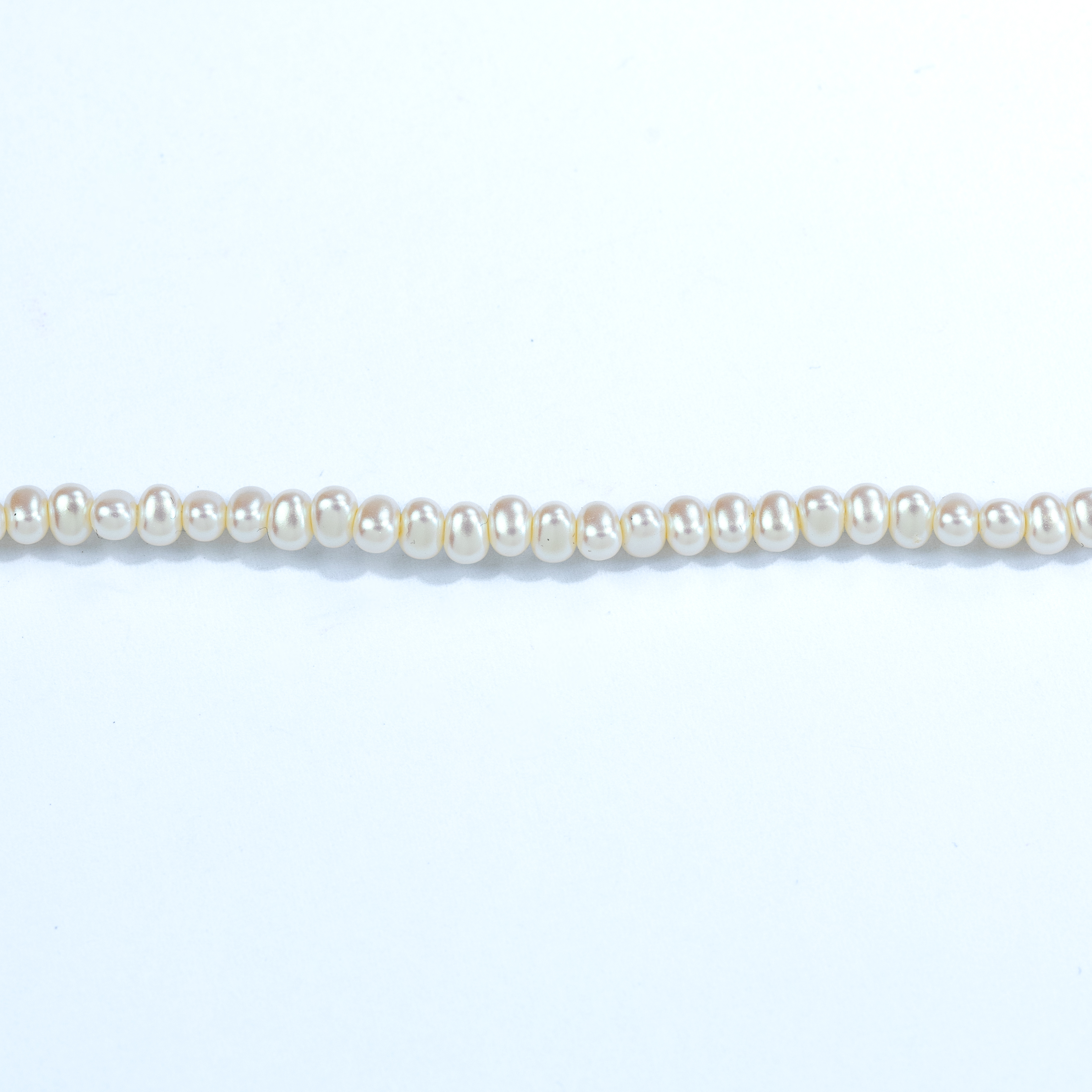 20499 Perla Imtacion Óvalo Marfil 4x6mm